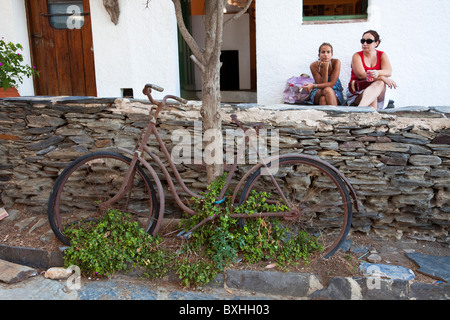 People with old bicycle in Port Lligat near Salvador Dali's home Parc Natural de Cap de Creus Emporda Catalunya Spain Stock Photo