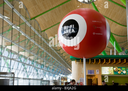 A wifi / wi fi area hotspot / hot spot sign / beacon for passenger internet access at Madrid Airport / airport. Spain. Stock Photo