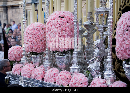 Close up / detail of flowers / roses on float / carriage taking part in Seville's Semana Santa Easter Holy week. Seville Spain Stock Photo