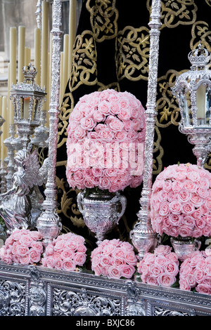 Close up / detail of flowers / roses on float / carriage taking part in Seville's Semana Santa Easter Holy week. Seville Spain Stock Photo