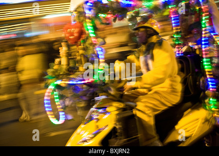 A man drives a decorated street car during Fiestas Patrias (Independence celebrations) in Lima, Peru, South America. Stock Photo