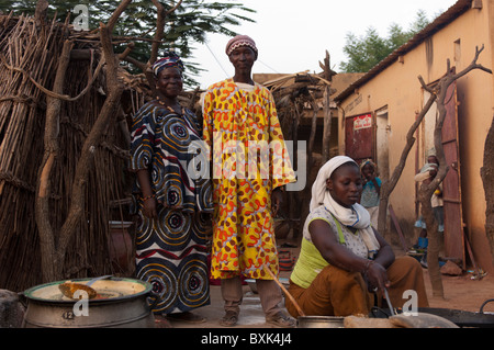 Owners of a primitive open 'restaurant:' in the village of Saye. Segou Region, Mali. Stock Photo