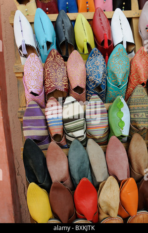 Colourful Babouches, a type of slipper, for sale in a  shop on rue de la Liberte in the Gueliz area of Marrakech Stock Photo