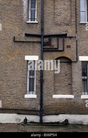 Cast Iron drainpipes and guttering on a Victorian building London UK Stock Photo