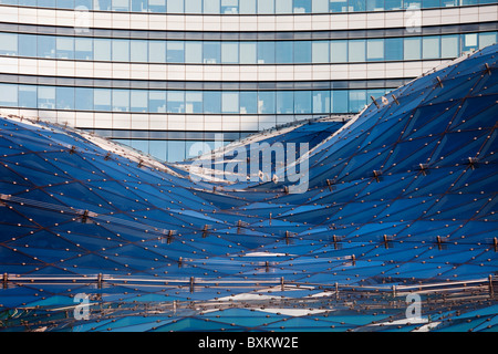 Glass roof abstract modern architecture, office building in the background Stock Photo