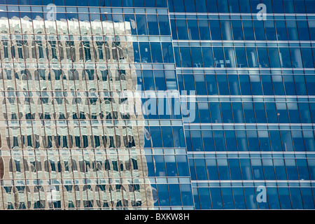 Reflection of a corporate office buildng in another office building windows Stock Photo