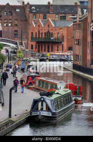 A line of colourful narrowboats at Gas Street Basin, Birmingham, UK Stock Photo