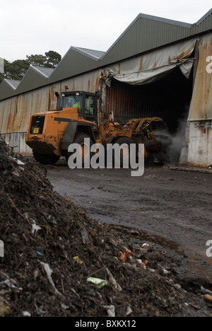 Front loader working at composting centre Stock Photo