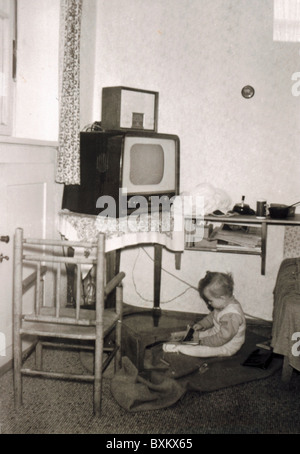 free time, playing child in front of a TV set, Munich, Germany, 1960, Additional-Rights-Clearences-Not Available Stock Photo