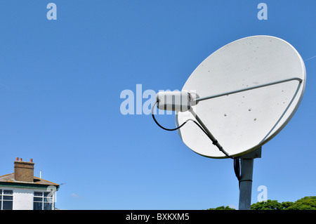 TV satellite dish set up at a racecourse - UK Stock Photo