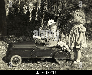 people, children, playing, boy and girl with pedal car, Germany, 1952, Additional-Rights-Clearences-Not Available Stock Photo