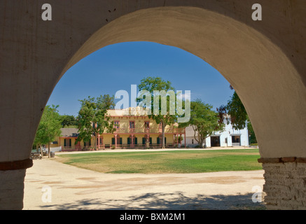 Central plaza seen from arcades of Mission San Juan Bautista, California, USA Stock Photo