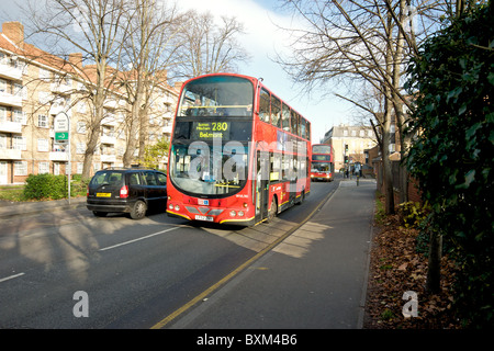 Bus 280 traveling through Mitcham town centre to Belmont via Sutton and Mitcham,  South London, England, UK Stock Photo