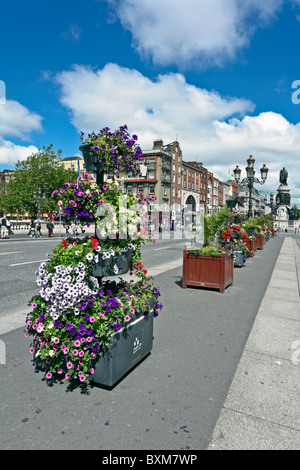 View towards O'Connell Street from O'Connell Bridge spanning River Liffey in Dublin Ireland Stock Photo