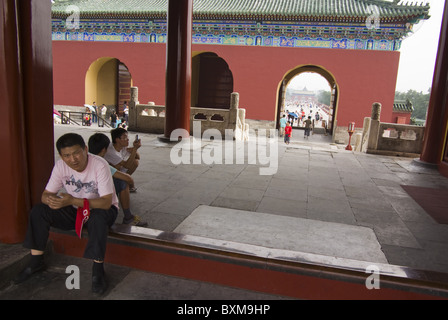 visitors taking a break on the way to the temple of heaven,beijing,china