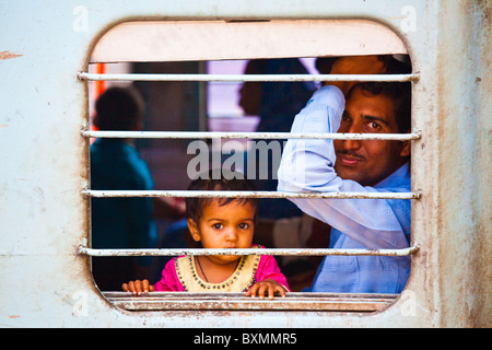 Indian Father and Child on a Train at Agra Fort Railway Station in Agra India Stock Photo