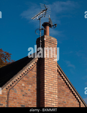 A satellite digital television arial on a roof Stock Photo