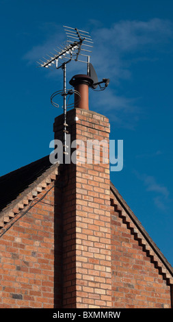 A satellite digital television arial on a roof Stock Photo