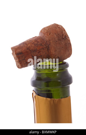 Champagne bottle and cork on a plain white background. Stock Photo