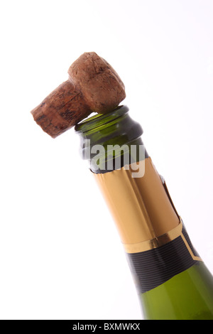 Champagne bottle and cork on a plain white background. Stock Photo