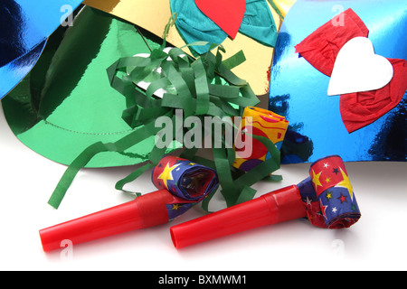 Party hats and party blowers on a plain white background Stock Photo ...