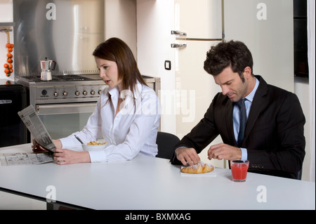 Couple having breakfast before going to work Stock Photo