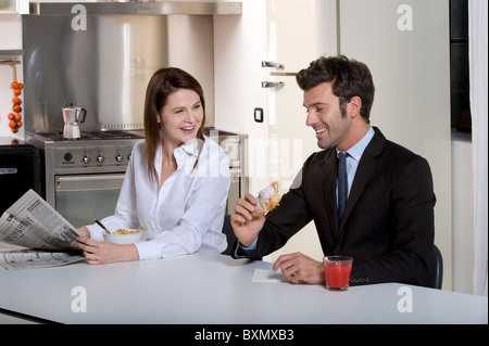 Couple having breakfast before going to work Stock Photo