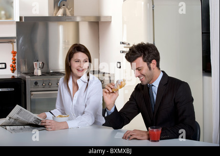 Couple having breakfast before going to work Stock Photo