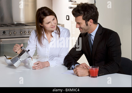 couple in the kitchen having breakfast Stock Photo