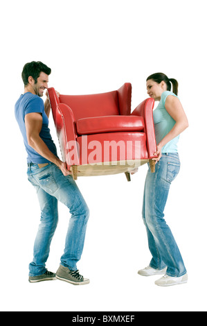 Couple carrying a chair Stock Photo