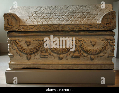 Marble sarcophagus with garlands of oak leaves supported by two erotes and four Victories adorn the front and sides. Stock Photo