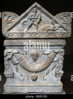 Marble sarcophagus with garlands of oak leaves supported by two erotes and four Victories adorn the front and sides. Stock Photo