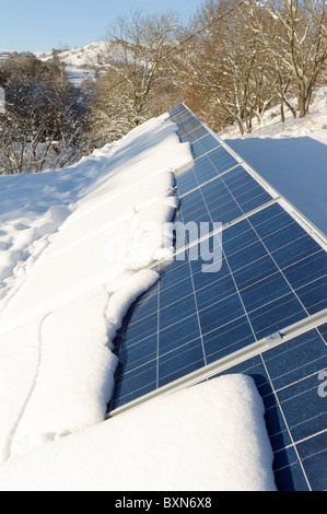 Photo-voltaic solar panel with snow Stock Photo