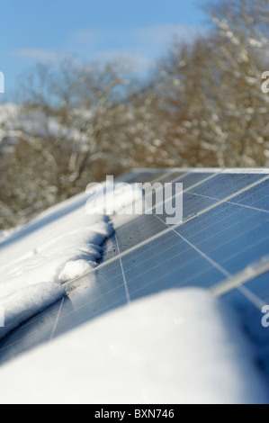 Photo-voltaic solar panel with snow Stock Photo