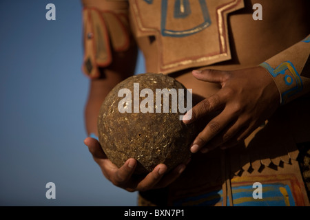 A Mayan ball player holds up the ball made of hule, natural rubber, in Chapab village in Yucatan, Mexico Stock Photo