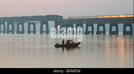 train crossing railway bridge over the River Tay Stock Photo