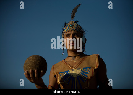 A Mayan ball player holds up the ball made of hule, natural rubber, in Chapab village in Yucatan state in Yucatan, Mexico Stock Photo