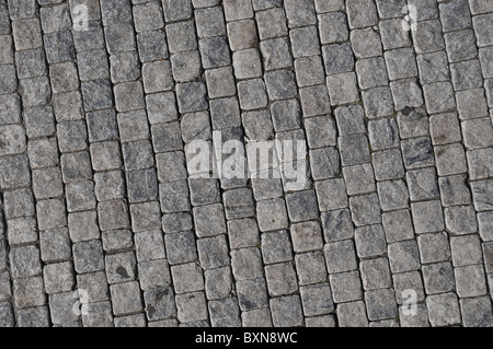 An image taken perpendicular to the ground of a patch of slabs of a traditional Italian road. Stock Photo