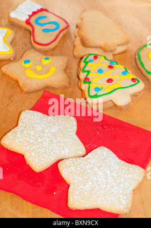 Colorful Christmas cookies on wooden tabletop Stock Photo