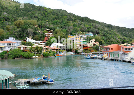 Boats and houses on canal, Fishing village, Barra da Lagoa, Florianopolis, Santa Catarina, Brazil, South Atlantic Stock Photo