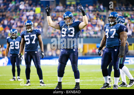 Seattle Seahawks' linebacker Julian Peterson (C) talks with defensive  tackles Ellis Wyms (L) and Craig Terrill (R) during a timeout in the fourth  quarter at Qwest Field in Seattle on November 12