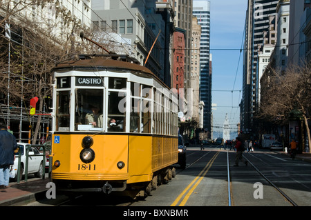 Old electric bus on downtown street in San Francisco CA USA Stock Photo