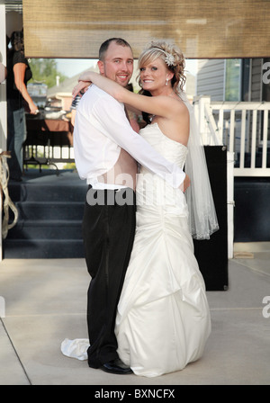 modern bride and groom dancing full-length Stock Photo