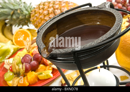 Chocolate fondue with various kind of fruit Stock Photo