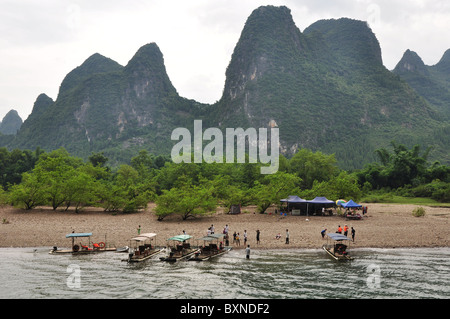 River boats on the Li River with beautiful karst hills in the background, Guilin area, Southern China Stock Photo