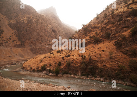 The Choman River running through a gorge in the Qandil range of the Zagros Mountains, in the Iraqi Kurdistan region of northern Iraq, Stock Photo