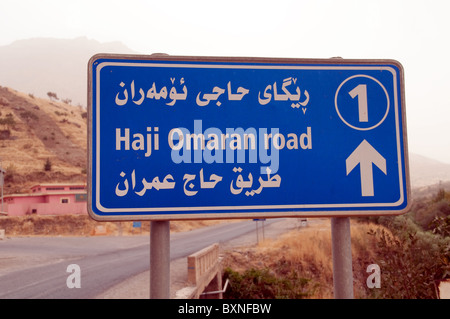 A sign for the Haji Omran Road, a highway running beside the Choman River and through the Zagros Mountains of Iraqi Kurdistan region of northern Iraq, Stock Photo