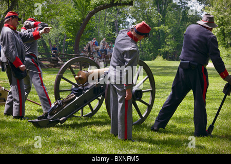 Confederate soldier reenactors fire a 12-pound Howitzer. Stock Photo