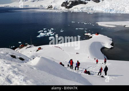 Tourists at Antarctic base Almirante Brown in Paradise Bay, Antarctic Peninsula, Antarctica Stock Photo