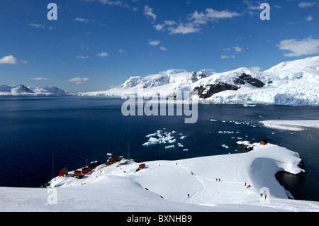 Tourists at Antarctic base Almirante Brown in Paradise Bay, Antarctic Peninsula, Antarctica Stock Photo